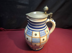 A Lovely patterned German Beer jug with pewter fittings