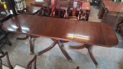 A Triple Pedestal Mahogany Table to Seat at least 12 Persons with 4 Removable with Brass Leaves Leg Capings and Castors. L.367 W.91 H.76 Cm.