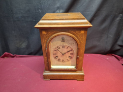 A Nice Rosewood Mantel clock with strike/Silent silvered dial. Approx. 24x36 cm