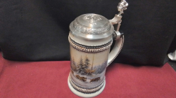 A unusual Germany beer Stein of wild Boar with Pewter top.