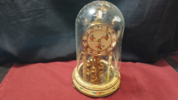 A Nice anniversary Clock with glass dome.
