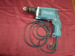 A Makita 710 Watt electric Hammer drill little used