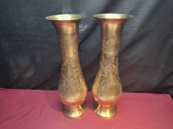 A Large pair of 16 inches high heavy brass vases heavily embossed with fauna