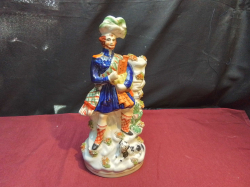A Staffordshire Flatback Scotish Piper. W.13 H.29 Cm.