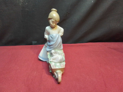 A NAO Figure of A Girl with A Barrow. H.20 Cm.