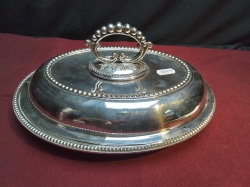 An Oval EPNs Entre Dish with Twist off Handle. L.29 W.22 Cm.