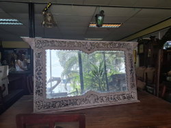 A carved wooden Wall Mirror. Approx.124x77 cm