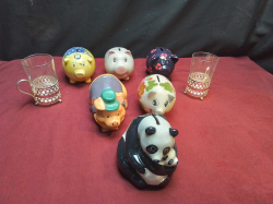 6 Old Amusing Banks (5 Piggys 1 Panda) and 2 Glasses with Silver Plated Handle.