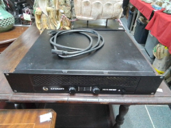 A Crown Amplifier XLS 802 with cable.