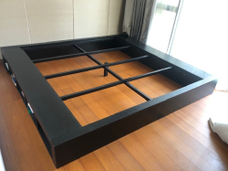 A U.S. queen sized bedframe with storage (mattress not included)