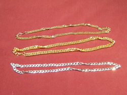 2 Gold plated and one silver necklace.
