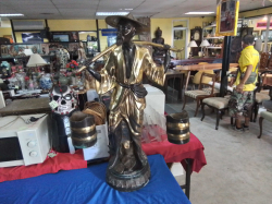 A Vietnamese  man Water Carrier . In brass with a two tone effect.
104cm high 62cm wide. 
Good condition