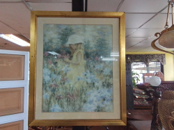 A large gilt framed print