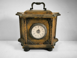 A wooden antique clock. W.26 H.22 D.10