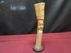 A 19th century antique African carved bone man figure on ebony stand 19cm high
