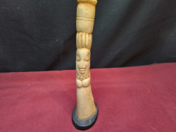 A 19th century antique African woman carved bone figure on ebony stand 20cm high