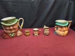 4 Toby Jugs and 1 Wade Jug.