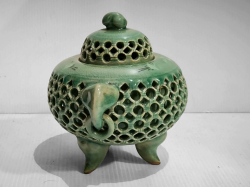 A Celadon incense burner with elephant head. W.17 H.14 Cm.