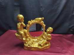 A Lovely Gold Plated Mirror With 2 Cupids and birds. W.31 H.26 Cm.