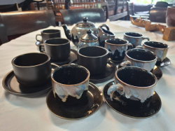 A Nice black dripped 23 pieces tea set included the tea pot, milk jug, sugar bowl