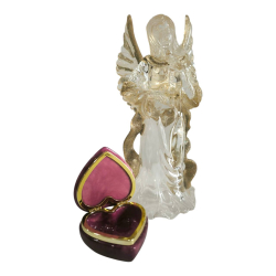 Two ornaments; An angle candle holder sculpture and an alabaster heart shape box made in Italy