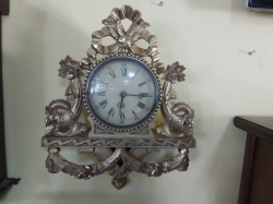 A Swedish Gilt Cartel Clock Hand Carved Wood by Swedish Farmer in 1930's Dark Winter Now Powered by Battery. W.39 H.50 Cm.