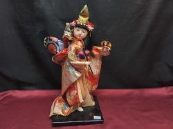 A Japanese female musician doll in beautiful costume on stand. W.25 H.40 Cm.