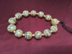 A very rare collectible Chinese bone beaded necklace each bead decorated 