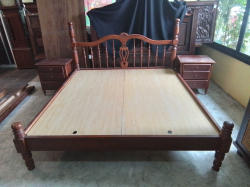 A King Size Wooden Bed with 2 bed side Cabinets.