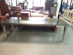A Large Marble Dining Table with Stainless Steel legs. W.84 L.254 H.79 Cm. 
