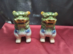 A pair of ceramic foo dogs 9