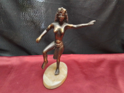 A bronze dancing Egyptian goddess with marble stand. W.20 H.26 Cm.  