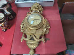A Swedish Hand Carved Gilt Clock with key & Pendulum (A/F)
