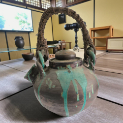 An antique very large dip glazed tea pot rattan handle very nice from Edo period approx H.60 (top handle) W.32 cm.