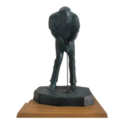 A bronze figure of man putting golf on wooden stand  H. 20 cm.