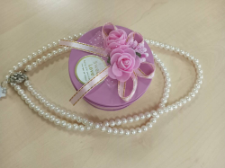A Lovely Pearl Necklace with pink box.