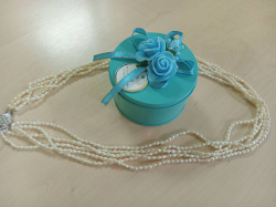 A Lovely Pearl Necklace with blue box.