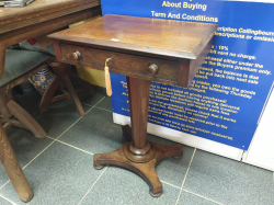 A very unusual Regency free standing C,1830 Rosewood single drawer pedestal table with original handles original bun feet and original working key. Beautiful piece of furniture and hard to find. D.39 W.54 H.73 Cm.