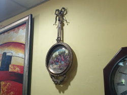 A beautiful rococoa style gilt metal bronzed porcelain hanging wall decoration with Greek Roman classical figurines applied to porcelain plaque. W.29 H.69 Cm.