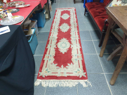 A beautiful thick ambitious style rug runner Sold as seen. 71x300 Cm.