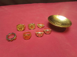 7 Gold Plated Gents Rings on a Gold 24k Ring Holder.