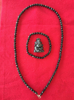 A small Jade Natural stone Ganesha and a  beautiful black Onyx stone necklace and bracelet.