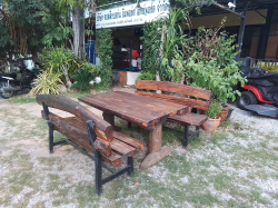 A Rustie Table W.81 L.150 H.72 Cm. and 2 Benches.