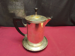 A Very Old Plated Coffee Pot and Stand.