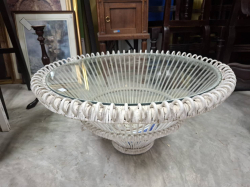 A Round white wicker glass topped table. w.69cm H.36 cm