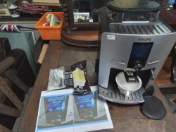 KRUPS Coffee Machine EA8250 with a built in grinder / A Control Panel with an LCD Screen for selecting different drinks and Equipment.  Brand new price is 37,290 Baht. ( Working perfect)