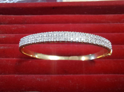 A beautiful diamond studded TENNIS BRACELET hallmarked 16 carat gold (purchased in Mumbai India) with 48 tested diamonds (weighs 18.4 grammes)