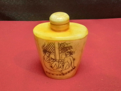 A Chinese bone perfume bottle decorated with erotic scenes 