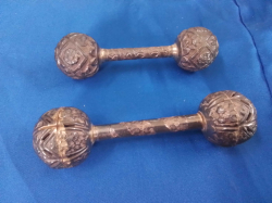  Two dumbbell shaped Afghan silver rattles 52grams and 56grams 