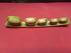 A vintage set of Golden Triangle Chinese ingot metal trade weights, weighing 17gm, 27gm, 40gm, 70gm, 87gm and the elephant stamped base 173gm. 